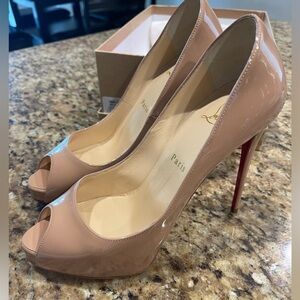 Authentic Christian Louboutin nude peep toe pumps